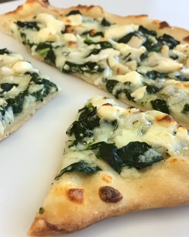 Homemade White Pizza with Spinach & Roasted Garlic photo